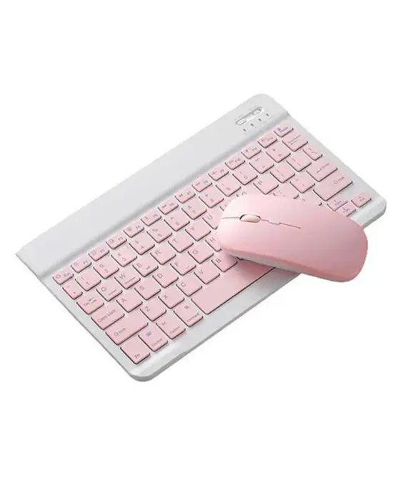 A pink keyboard and mouse sitting on top of a white table.